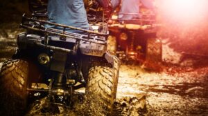 Home Page 26 2 quad bikes driving through mud